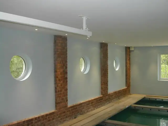 Indoor swimming pool with round feature windows