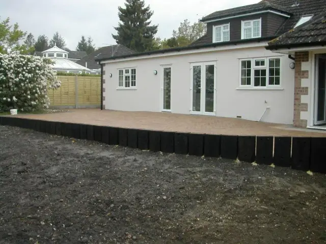 Rear extension with new patio and sleeper edging