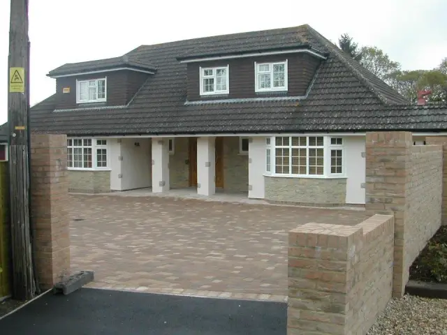 Renovated bungalow with dormer windows and driveway