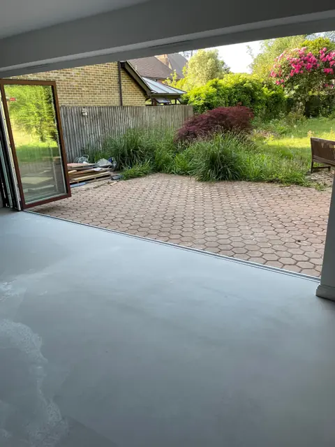 Bi-fold doors open from the new ground floor space onto the patio and garden