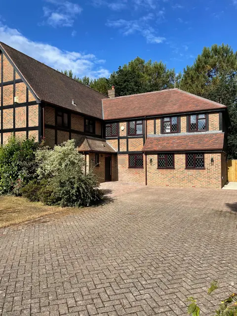 The finished house, with the new two storey extension on the right and a block paved drive