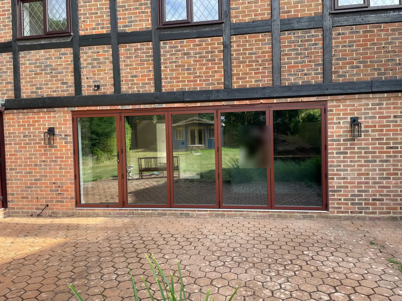 The rear of the house with new bi-fold doors opening onto the patio