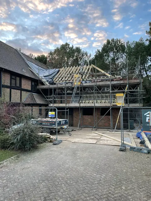 The new roof frame above the scaffolding at the front of the house