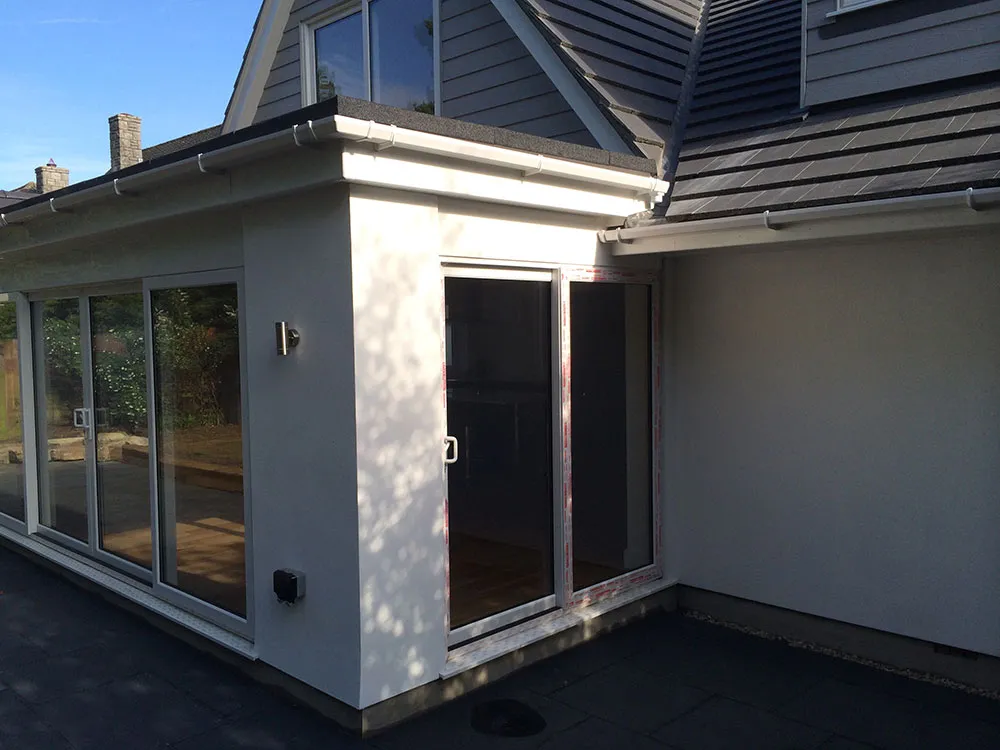 Rendered extension corner with glazed side door
