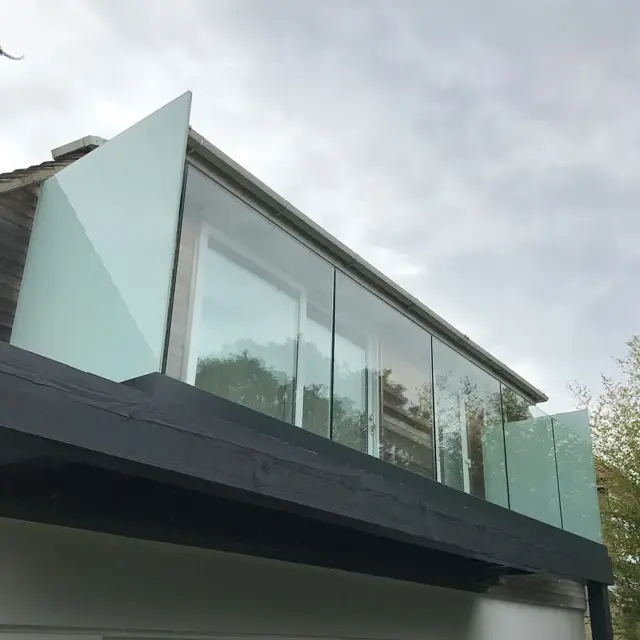 Frameless glass balcony balustrade on new extension