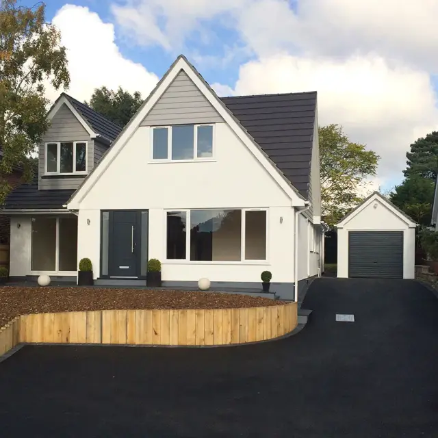 Rendered new build home with tarmac driveway