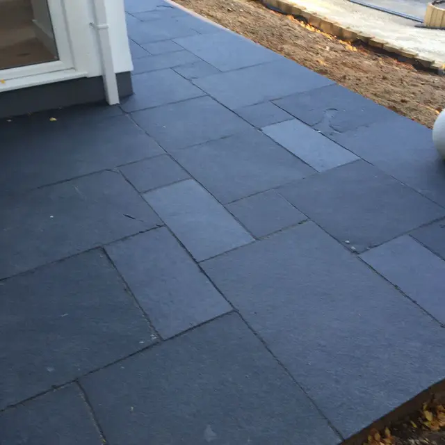 Close-up of dark slate patio paving slabs