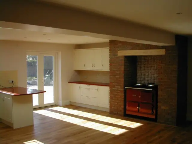 Kitchen extension with brick chimney and range cooker