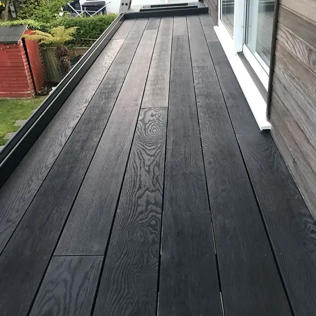Composite decking on flat roof terrace extension
