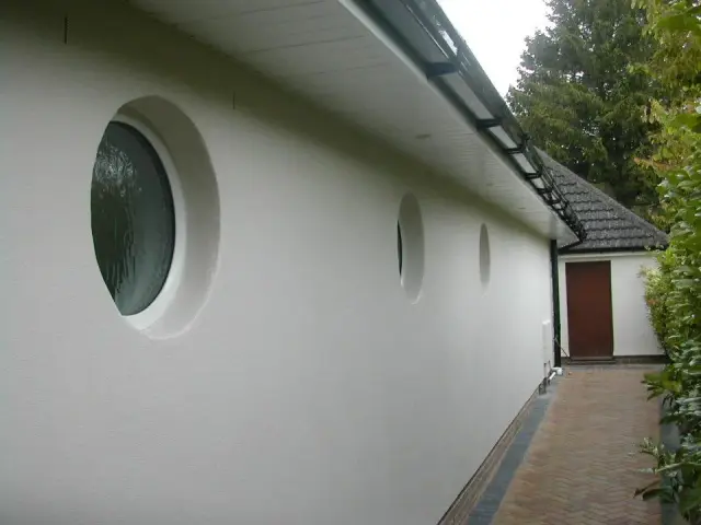 Rendered wall with circular porthole windows